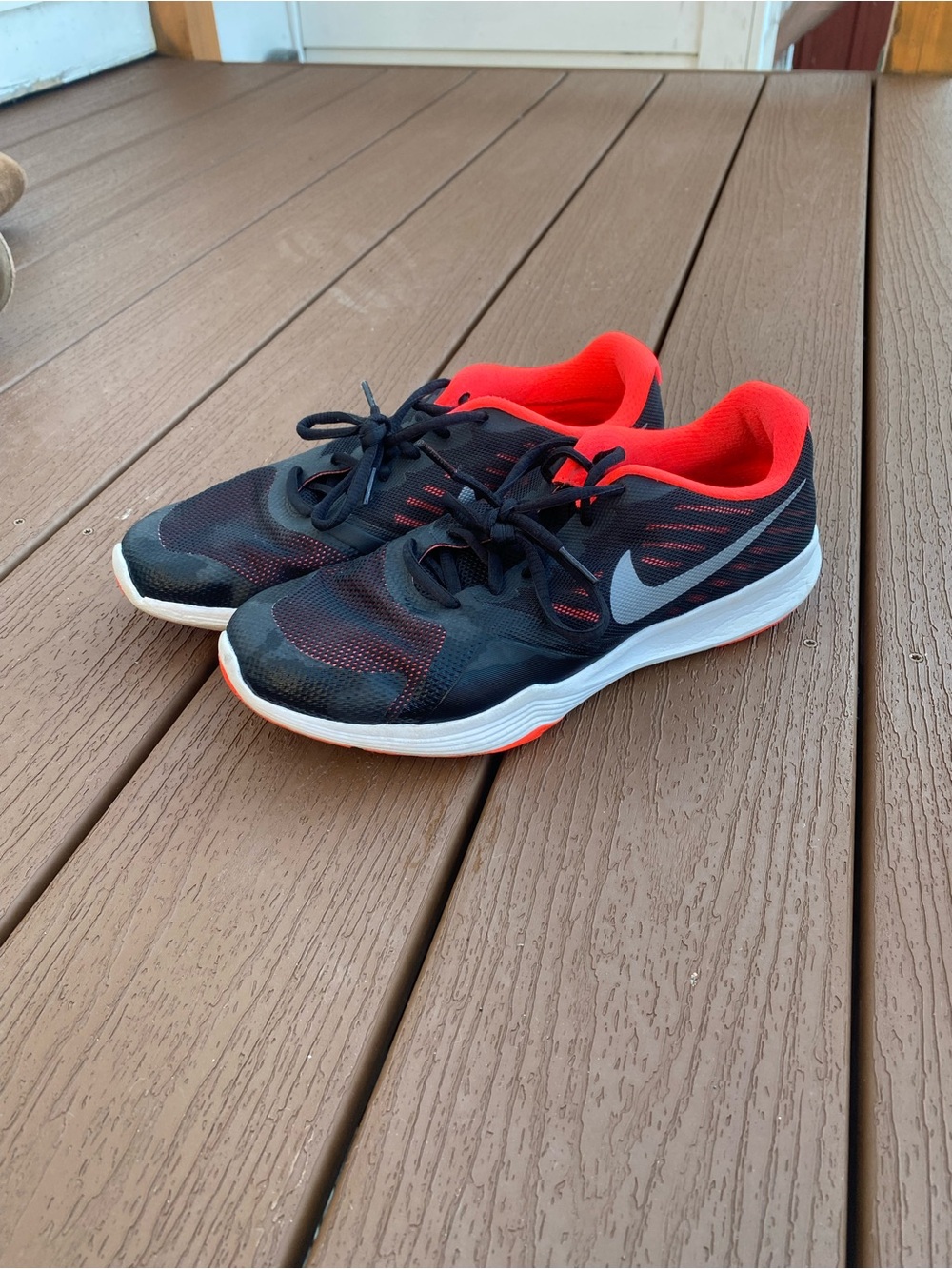 Nike Black Sneakers with Coral Lining and Metallic Swoosh